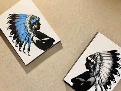 two cards with a picture of a man in an indian headdress at Tokyo ShinjukStation 800meters kabukicho2minutes 403 in Tokyo