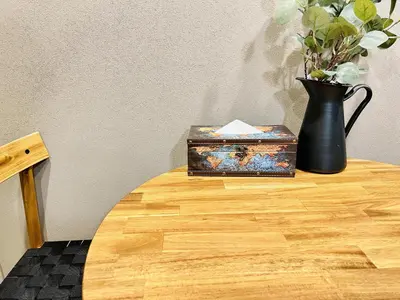 a table with a vase and a box on it at Tokyo ShinjukStation 800meters kabukicho2minutes 403 in Tokyo