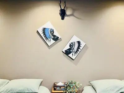 three pictures on a wall above a bed at Tokyo ShinjukStation 800meters kabukicho2minutes 403 in Tokyo