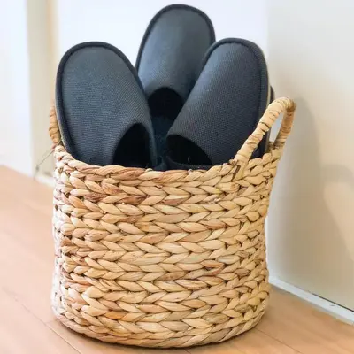 a basket with a pair of flip flops in it at 2BR 35m2 Bright Parkside Apt - JR 8 min Shinjuku in Tokyo