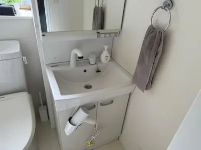 a small bathroom with a sink and a toilet at Direct access to major Tokyo stations including Shibuya, Shinjuku, Ikebukuro, Akihabara, and Ueno 3-minute walk from nearest station Tokyo Dome Suitable for long-term stays 101 in Tokyo
