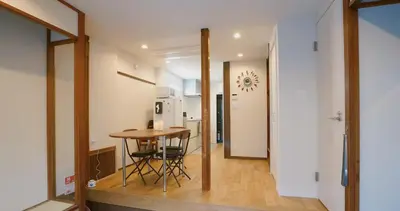 a small kitchen and dining room with a table and chairs at 'OOGI House' Spacious Restored Traditional Machiya 53m2 with Tatami in Tokyo