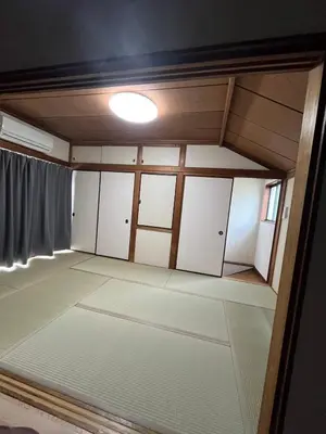 an empty room with white cabinets and a ceiling at Abeno house at Koenji in Tokyo