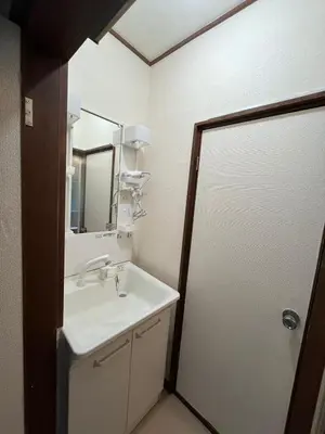 a bathroom with a sink and a mirror at Abeno house at Koenji in Tokyo