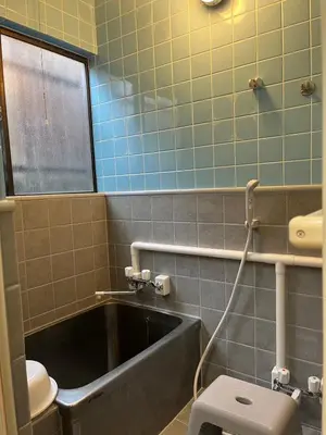 a bathroom with a bath tub and a toilet at Abeno house at Koenji in Tokyo