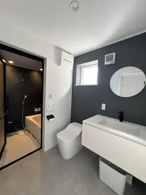 a bathroom with a toilet and a sink and a mirror at KICHI 2F 10min to Shinjuku in Tokyo