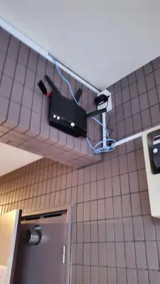 a camera on the wall of a kitchen at Sunny Haven in Tokyo in Tokyo