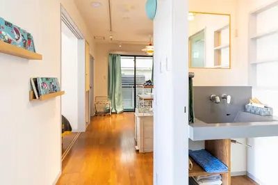 a bathroom with a sink and a mirror at Crest House in Tokyo