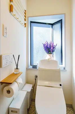 a bathroom with a toilet and a window at Crest House in Tokyo