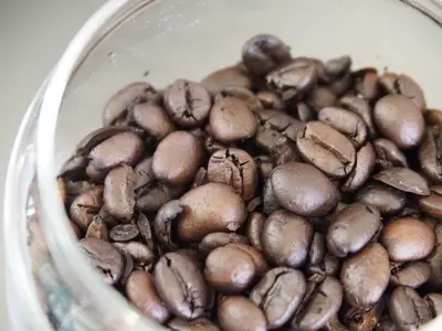 a pile of brown beans in a cup at Yamatsu Tokyo House in Tokyo