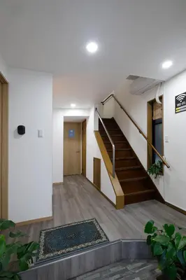 an empty hallway with stairs and a rug at Tokyo My Home 2 in Tokyo