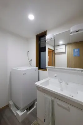 a bathroom with a sink and a toilet and a mirror at 3 min from Shin-Okubo l Private Single Room 4 in Tokyo