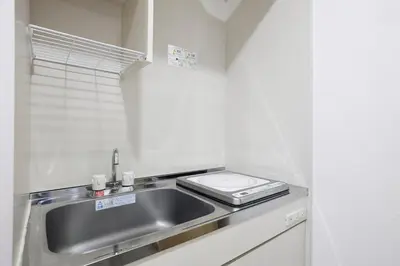 a kitchen with a sink and a stove at 3 min from Shin-Okubo l Private Single Room in Tokyo