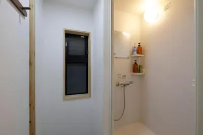 a bathroom with a shower and a mirror at 3 min from Shin-Okubo l Private Family Room for 5 in Tokyo