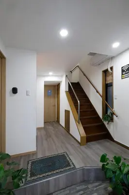 a staircase in a house with a stair case at 3 min from Shin-Okubo l Family Room for 4 in Tokyo