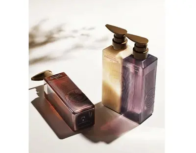a close up of two bottles of soap and a box at R-Styles \u6e0b\u8c37 in Tokyo