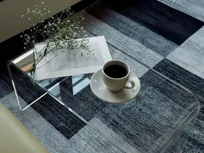 a cup of coffee sitting on a glass table at Mando Hotel 201 ,direct to Ueno,Asakusa in Tokyo