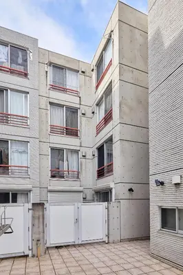 an external view of an apartment building at 3-min walk to bus stop, direct to Shibuya Shinjuku in Tokyo