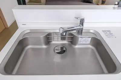 a stainless steel sink with a faucet in a kitchen at Tokyo Kanamachi Inn in Tokyo