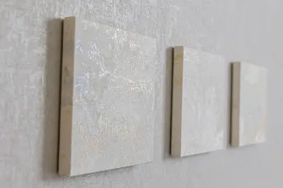 two pieces of artwork hanging on a wall at \u4e09\u8ed2\u8336\u5c4bCasa Blanky in Tokyo