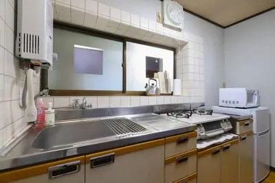 a kitchen with a sink and a microwave at \u7985-zen-Tokyo Itabashi in Tokyo