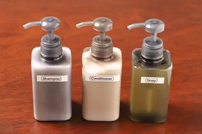 three bottles of soap sitting on top of a table at \u7985-zen-Tokyo Itabashi in Tokyo