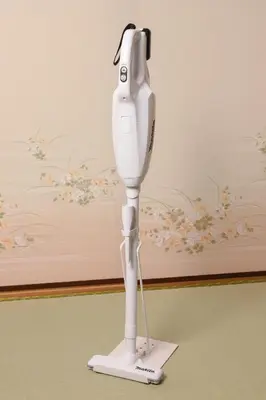 a white electric hair dryer sitting on a stand at \u7985-zen-Tokyo Itabashi in Tokyo