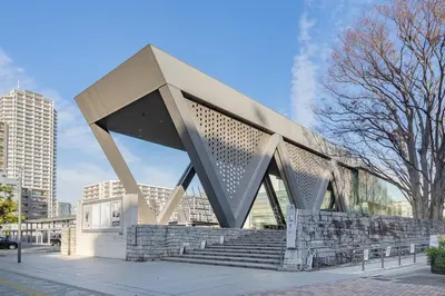 a building with a sculpture on top of some stairs at M's GARDEN KIYOSUMI in Tokyo