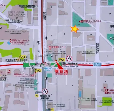 a map with a red circle and a star at Kabuki house in Tokyo
