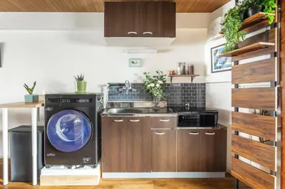 a laundry room with a washer and dryer at Happy House Residence in Tokyo