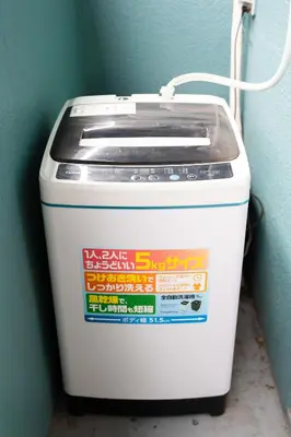 a white ice chest sitting next to a wall at Kamimachi Stay102 in Tokyo