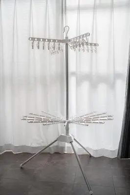 a silver wine rack with wine glasses on it at Kamimachi Stay102 in Tokyo