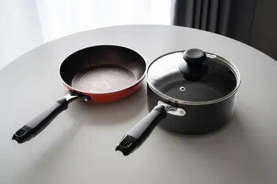 a pot and a saucepan on a table at Kamimachi Stay102 in Tokyo