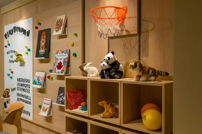a shelf with stuffed animals and a basketball hoop at Sumu Ueno East in Tokyo