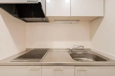 a small kitchen with a sink and a stove at Sora Den-en Stay in Tokyo