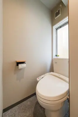 a bathroom with a toilet and a window at Sora Den-en Stay in Tokyo