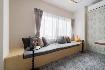 a bedroom with a bed with a window at Sora Den-en Stay in Tokyo