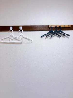 a wooden rack with three pairs of scissors on it at \u30af\u30aa\u30ea\u30c6\u30a3\u30cf\u30a4\u30c4101\u53f7\u5ba4 in Tokyo