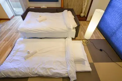 two beds sitting next to each other in a room at Chill Place 133 Keisei Koiwa in Tokyo