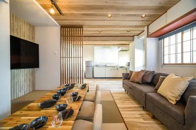 a living room with a couch and a table at Chill Place 133 Keisei Koiwa in Tokyo