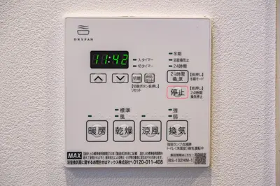 a sign on a wall with a clock on it at Chill Place 133 Keisei Koiwa in Tokyo