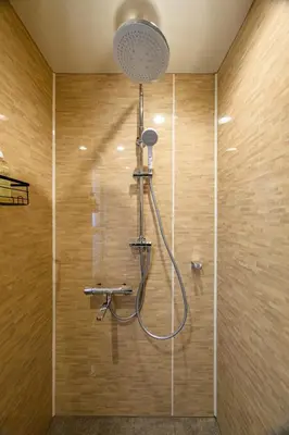 a shower with a shower head in a bathroom at Chill Place 133 Keisei Koiwa in Tokyo