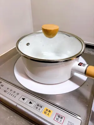 a pot with a wooden spoon on top of a stove at \u30af\u30aa\u30ea\u30c6\u30a3\u30cf\u30a4\u30c4301 in Tokyo