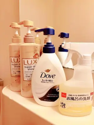 a shelf with four bottles of cleaning products on it at \u30af\u30aa\u30ea\u30c6\u30a3\u30cf\u30a4\u30c4301 in Tokyo