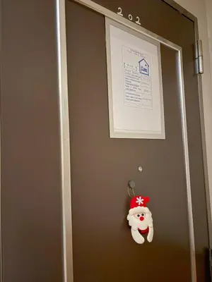 a door with a santa claus ornament on it at 5-min walk from Higashi-Ikebukuro your second home in Tokyo