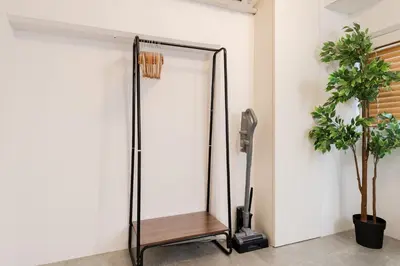 a glass shower stall in a room with a plant at Shibuya Beatles house 10min walk from Shibuya Station in Tokyo