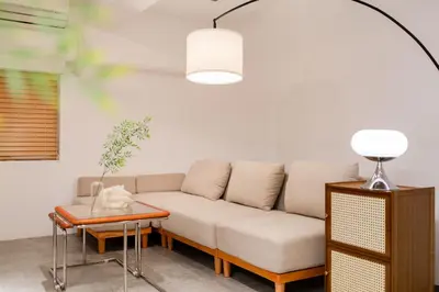 a living room with a couch and a table at Shibuya Beatles house 10min walk from Shibuya Station in Tokyo