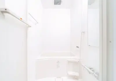 a white kitchen with a sink and a refrigerator at Alice JueQie 1minute walk to Horikiri Station ,Super convenient transportation ,Direct access to Narita Airport , Drugstore, convenience store, and shopping center downstairs in Tokyo