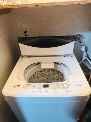 a washing machine in a bathroom with its door open at Maison du Skytree Tokyo in Tokyo