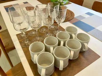 a group of glasses and wine glasses on a table at Designer 2BR with Japanese & Western Style Near Shinjuku Subway 5-Min up to 6 people in Tokyo
